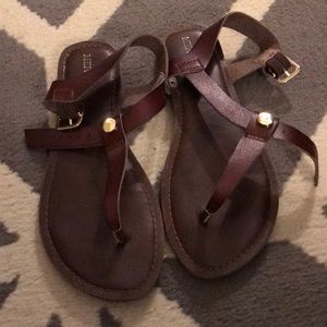 Brown strappy sandals.